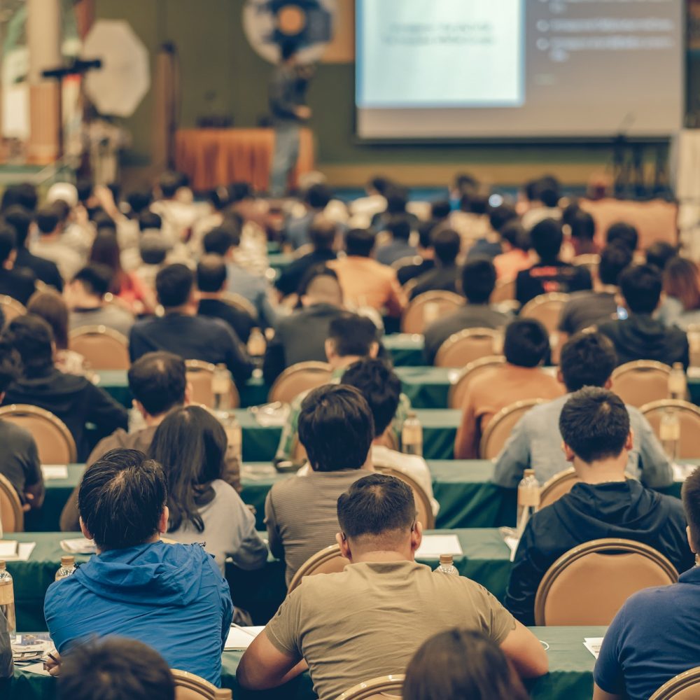 rear-view-of-audience-in-the-conference-hall-or-seminar-meeting-which-have-speakers.jpg